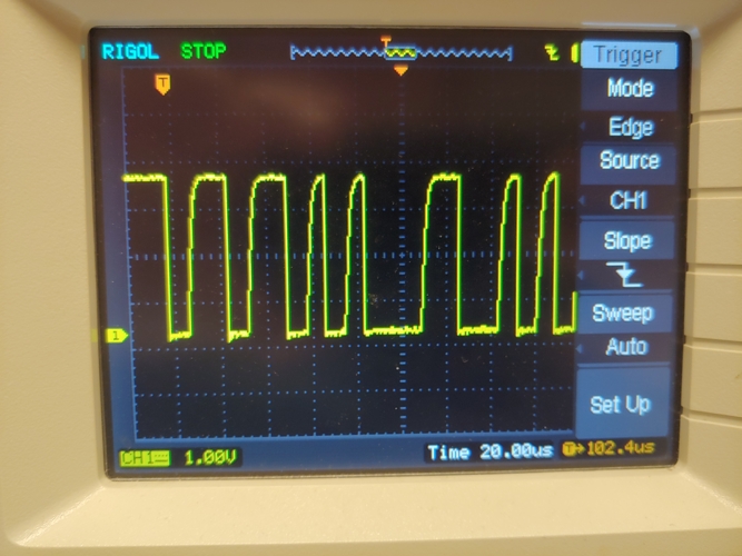 photo of oscilloscope showing serial waveform